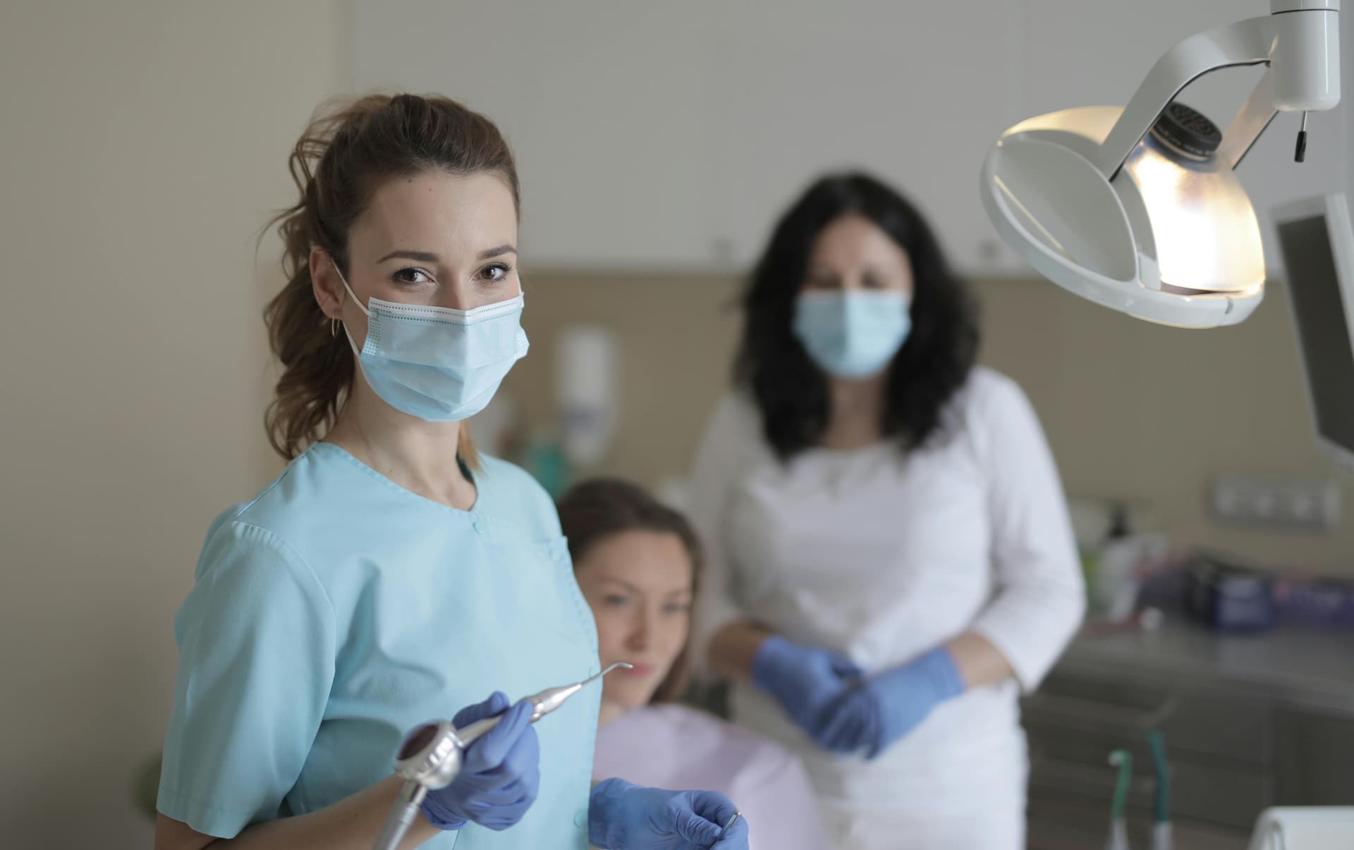 Dental professionals working in a modern clinic